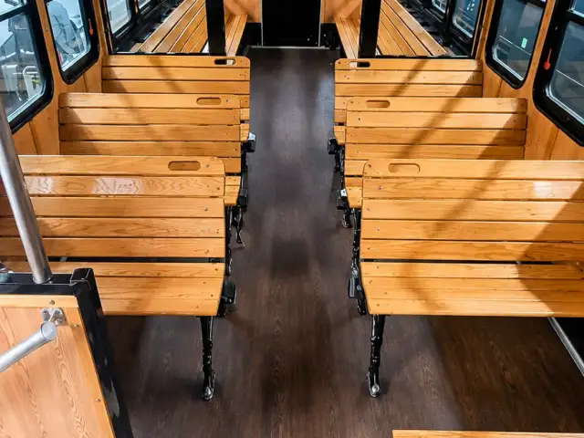 The classic trolley’s wood-finished cabin with forward-facing seats.